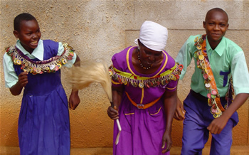 Kenyan kids wearing bottle cap belts